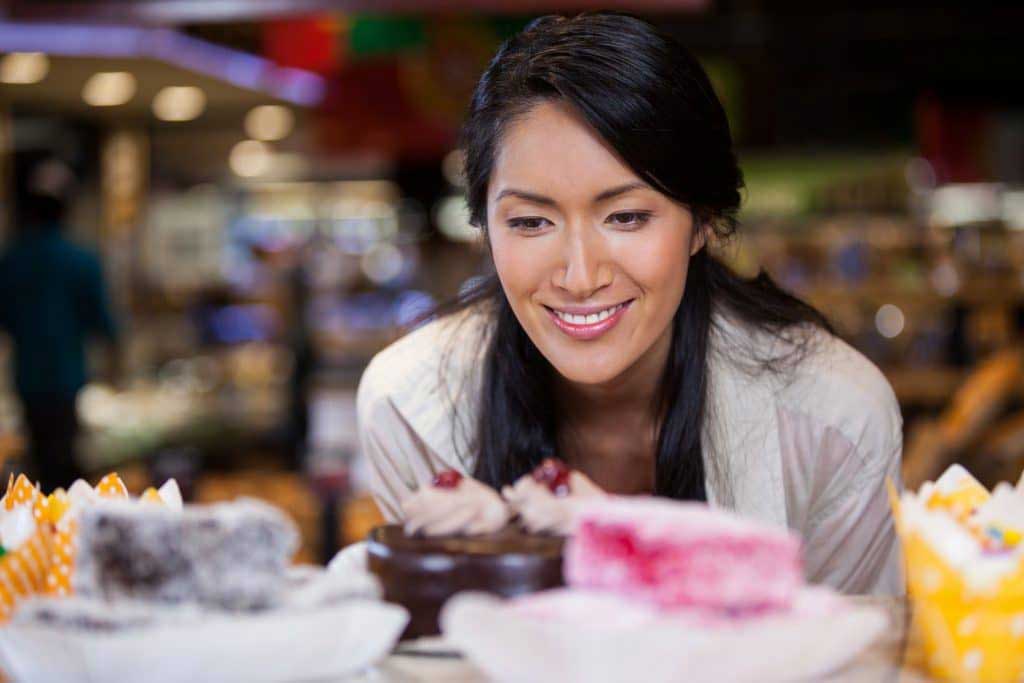 woman looking at different food choices